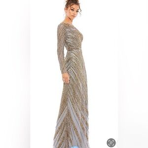 MAC Duggal long sleeve beaded Column gown features a semi- sheer sleeves.